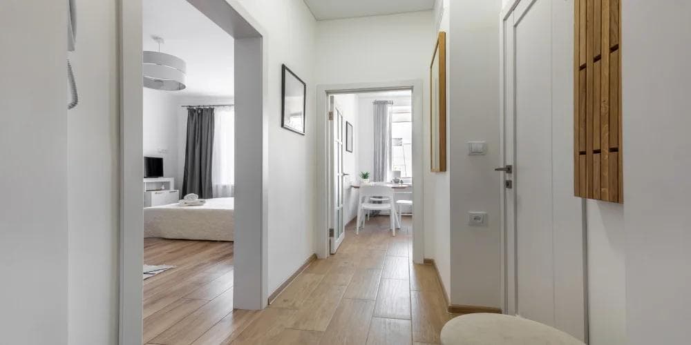 Bright HDB flat hallway in Singapore styled with Feng Shui principles by a feng shui master for HDB.